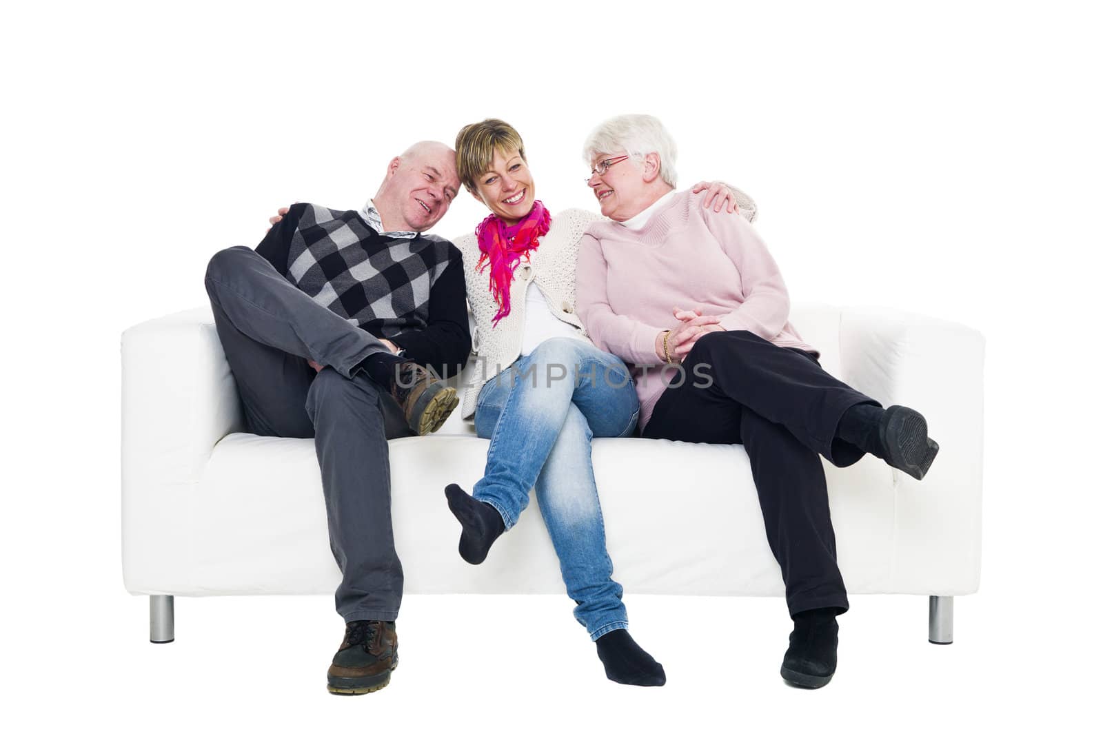Woman with her parents in a sofa isolated on white background
