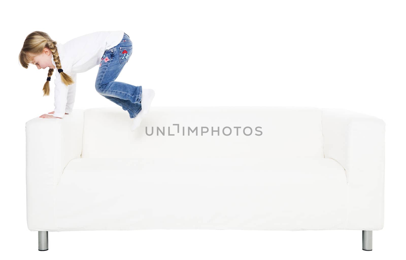 Young girl in a sofa isolated on white background