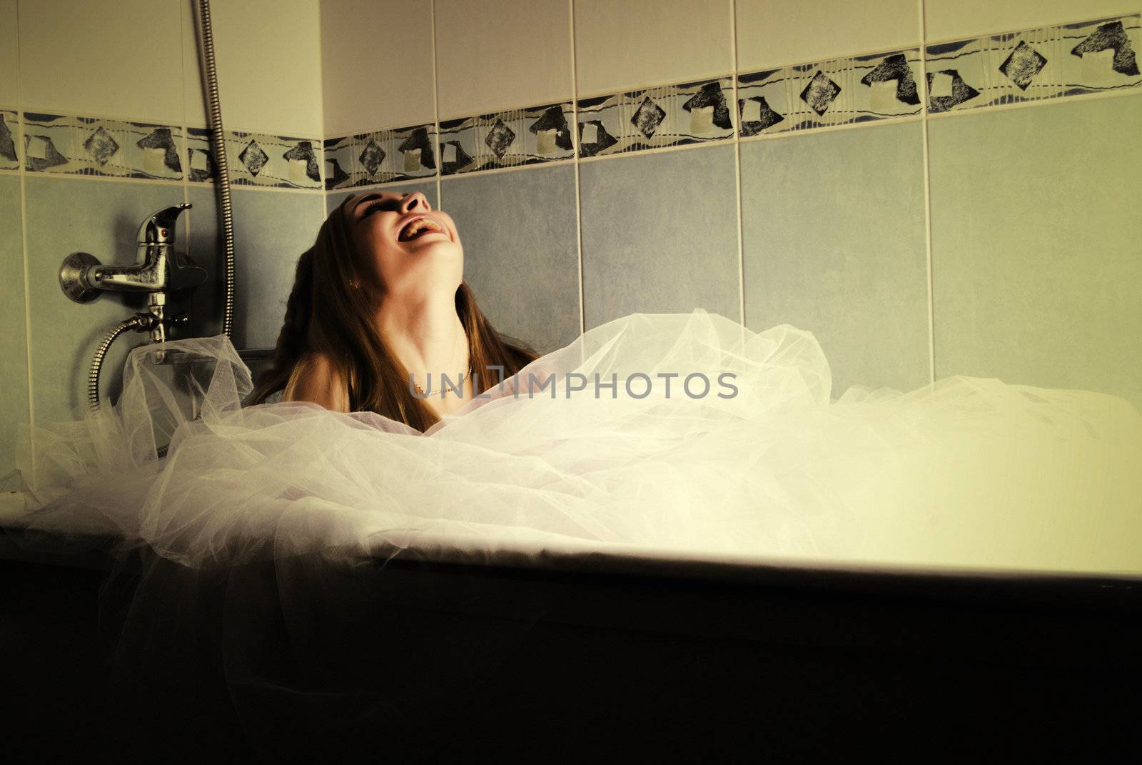 young bride posing in bathroom