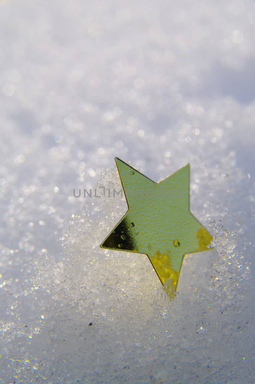 golden snow stars on a real snowy icy surface