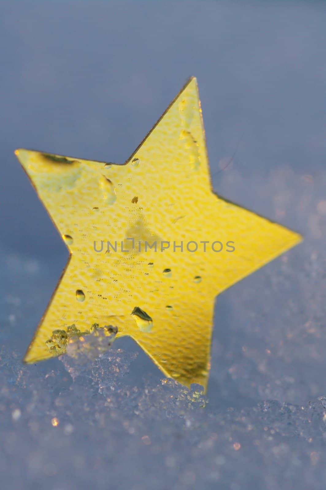 golden snow stars on a real snowy icy surface