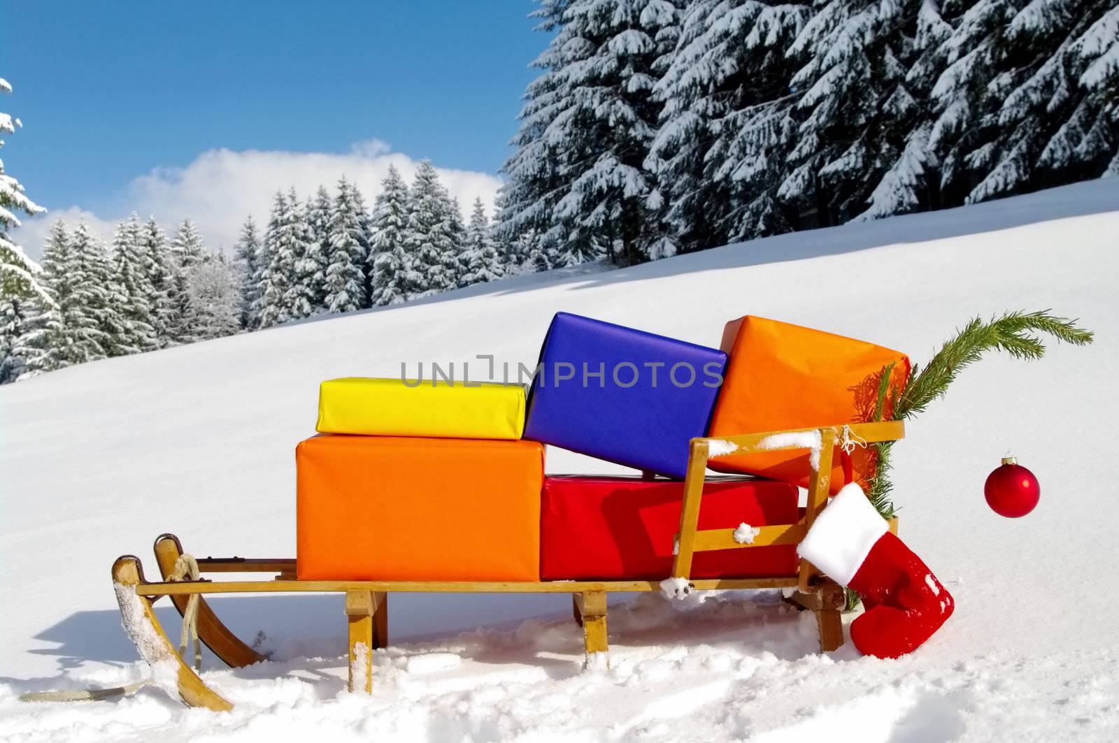 colorful presents on a Santa Claus sledge in a winter landscape