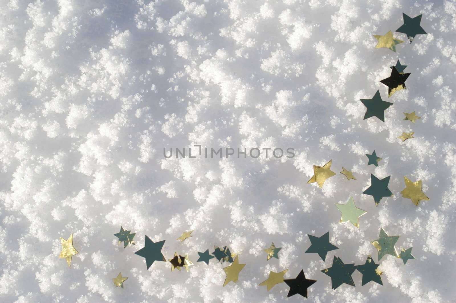 golden snow stars on a real snowy icy surface