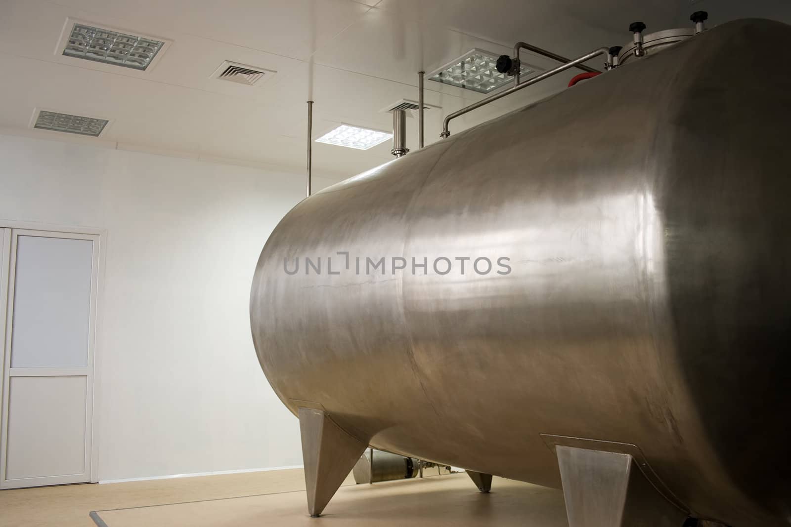 Placing plant medicines, large stainless tank