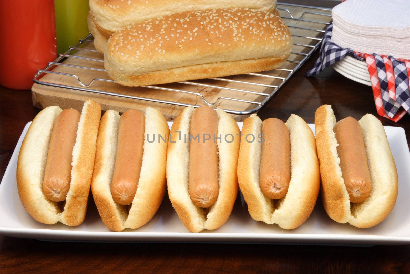 hot dog ingredients on a nice table setting rich in colors and flavors  