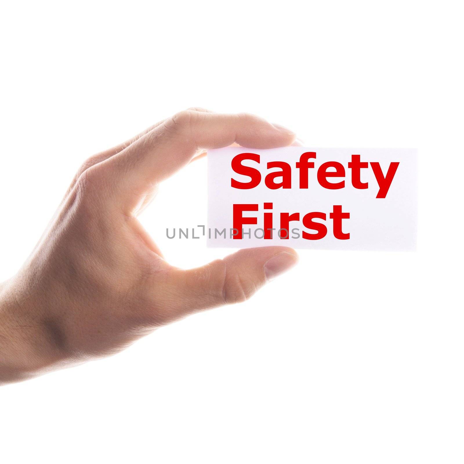 safety first concept with hand word and paper