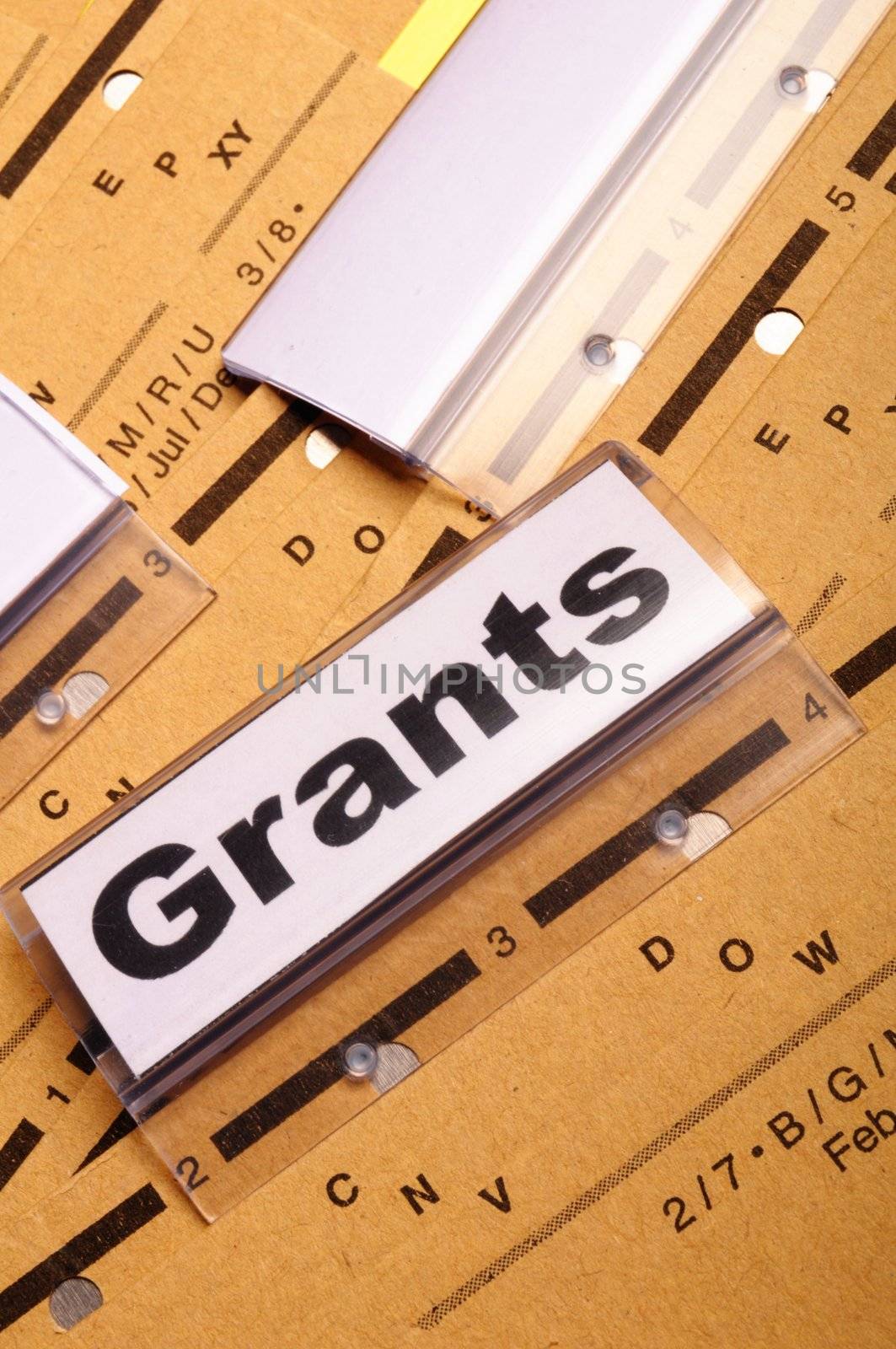 grants word on paper folder showing scholarship or higher education concept