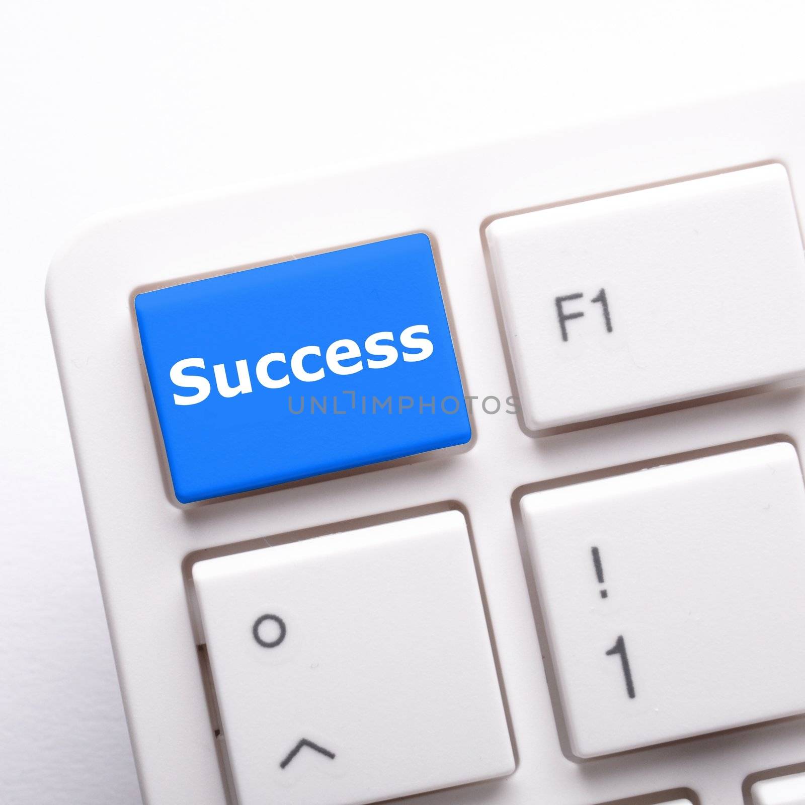 success in business concept with key on computer keyboard