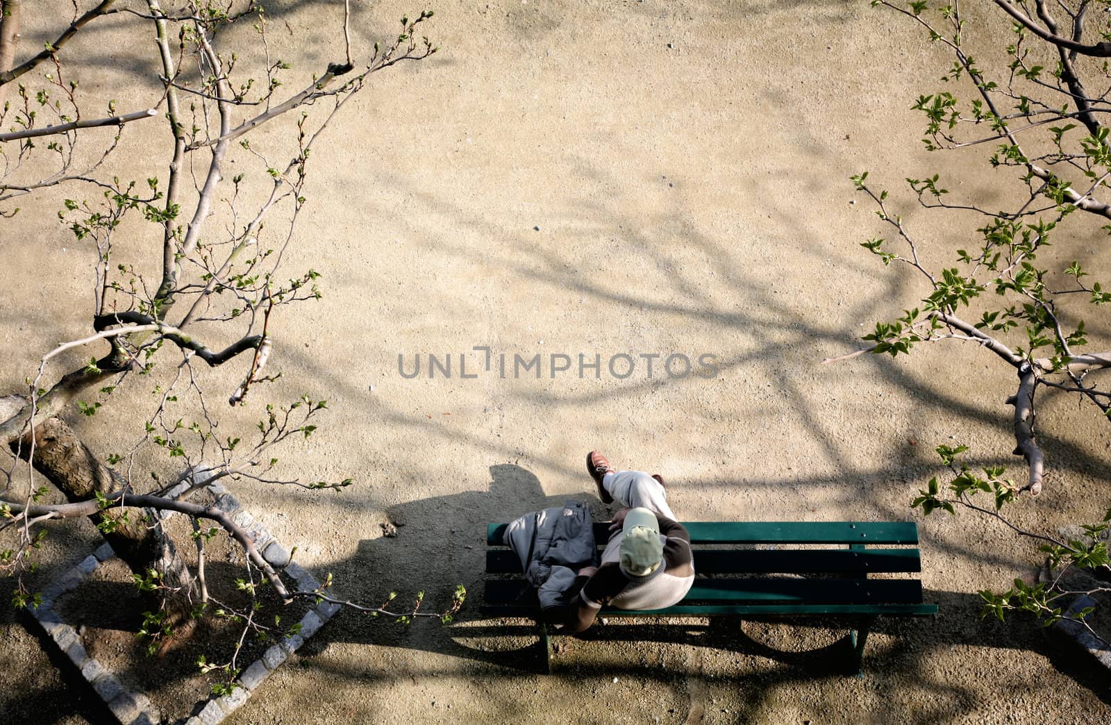 Top view of a man sitting on a bench