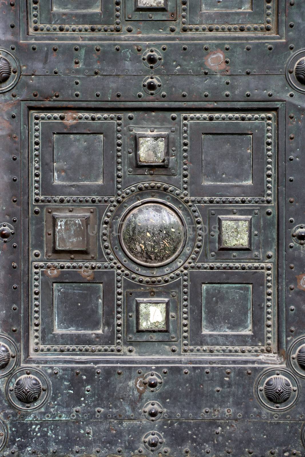 Section of an old metal gothic door.
