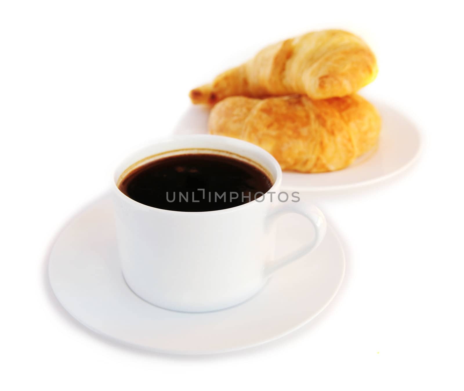 Breaksfast of black coffee and fresh croissants isolated on white background
