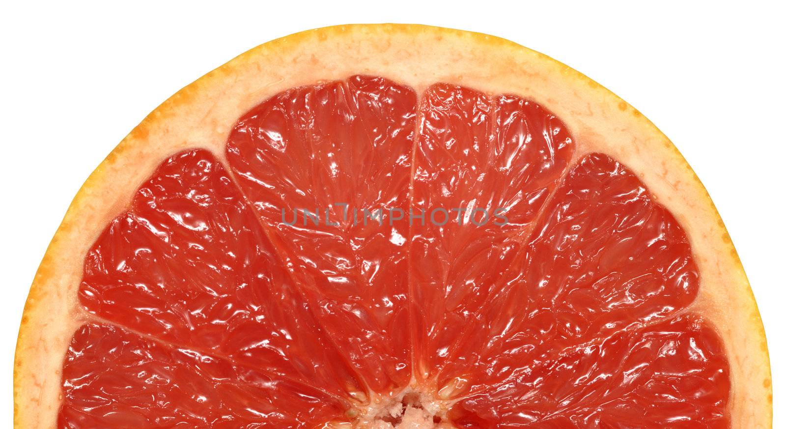A closeup background image of half a juicy pink grapefruit.
