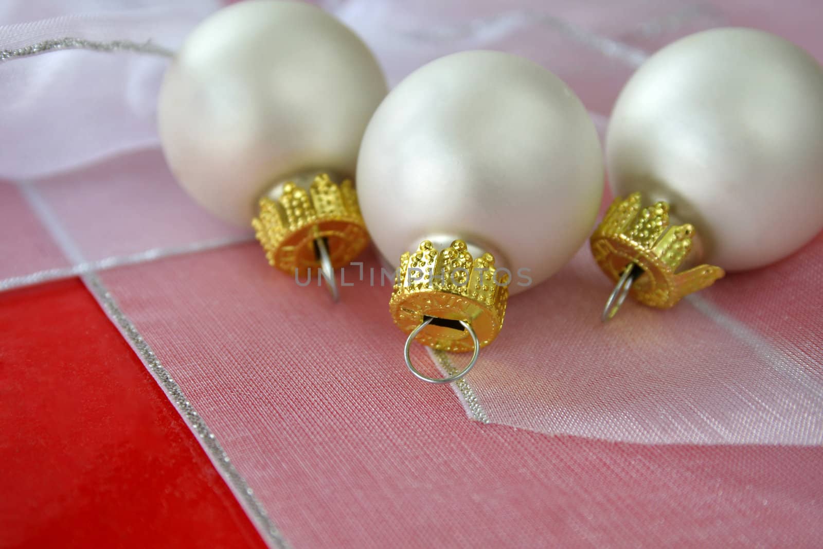 White Christmas ornaments with selective focus.