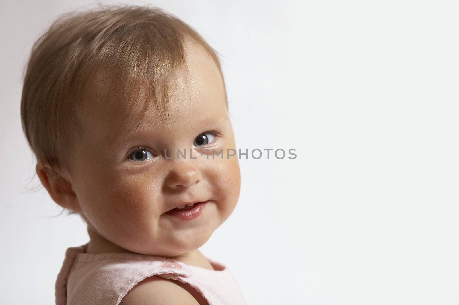 portrait of eight month baby. little girl smile