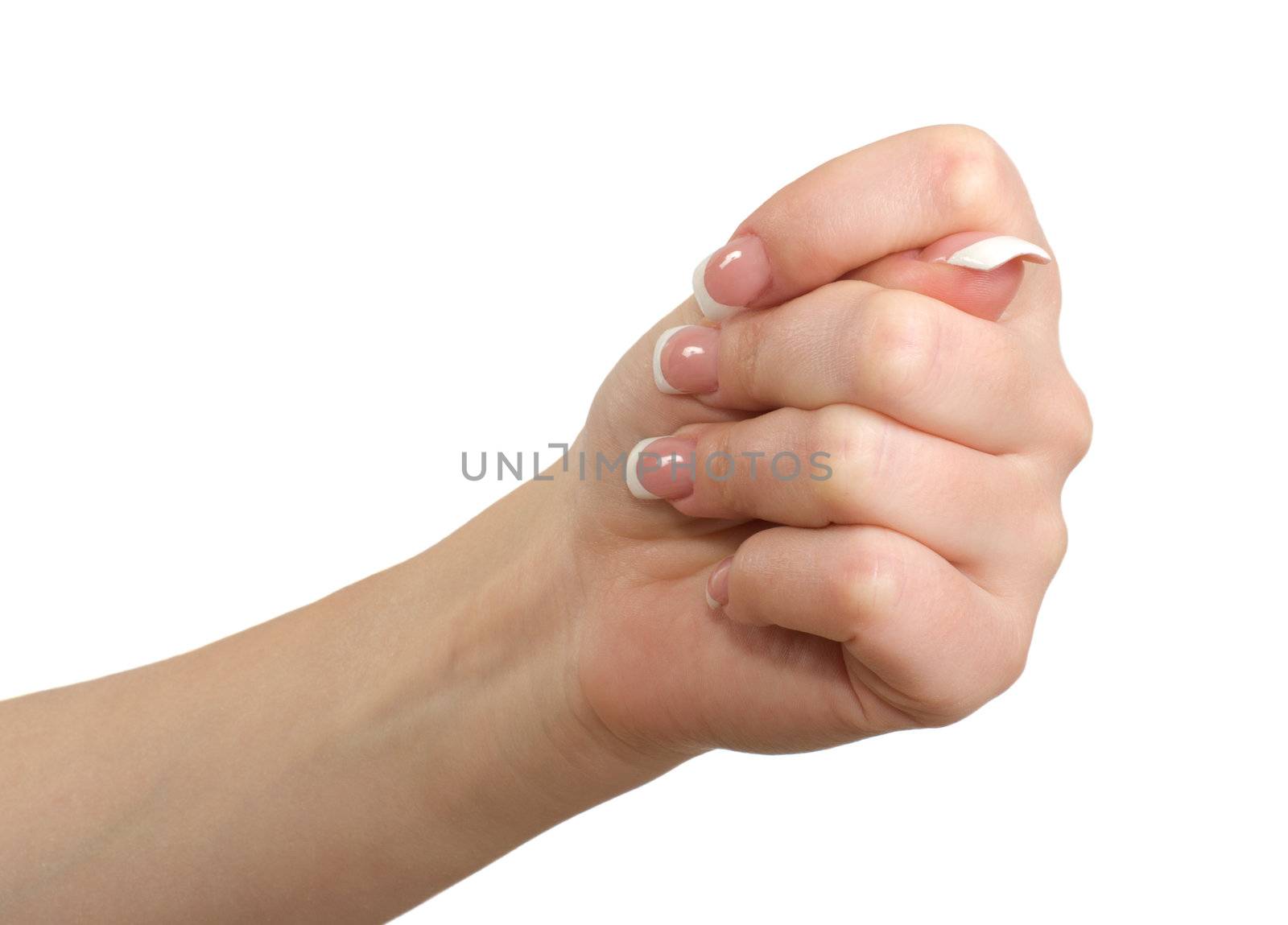 Woman's hand in close-up shows fig isolated on a white background.