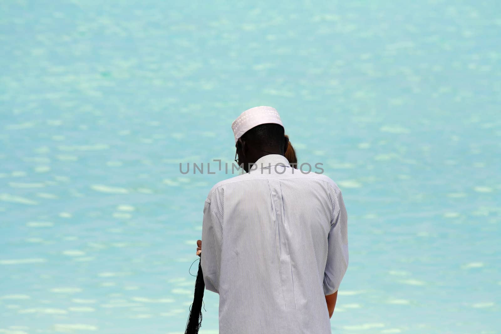 A shell necklace seller on the beach in Nungwi, Zanzibar