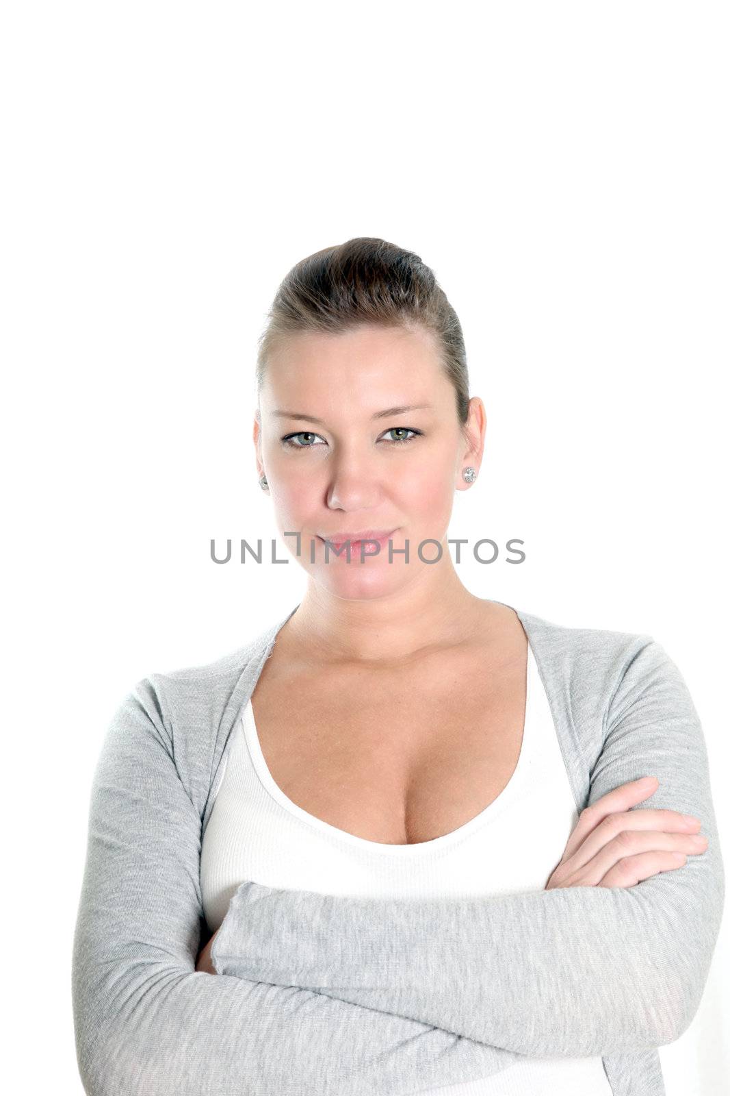 portrait of a determined woman with arms crossed in front of white background
  