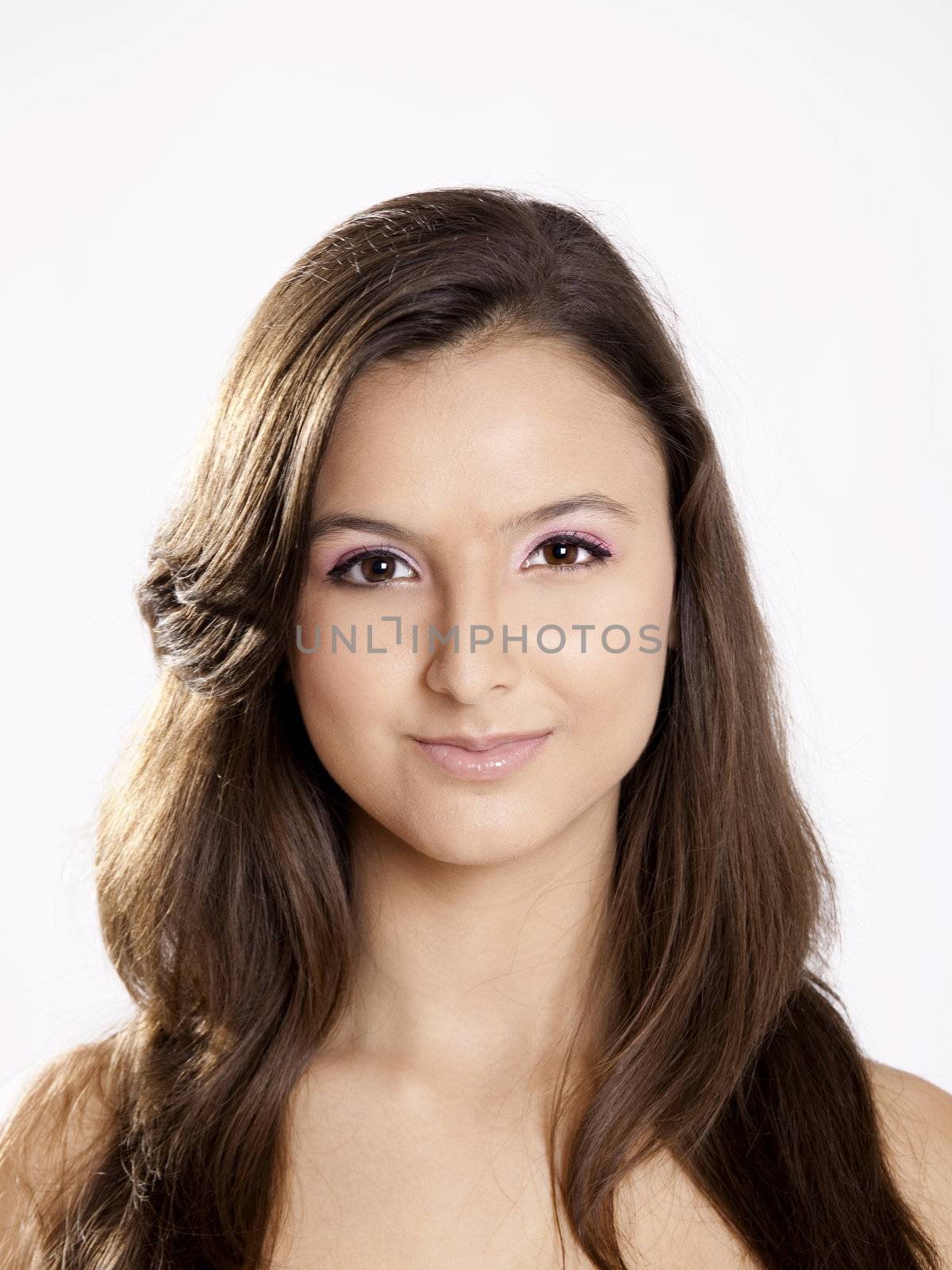 Close-up portrait of a beautiful teenage girl smilling