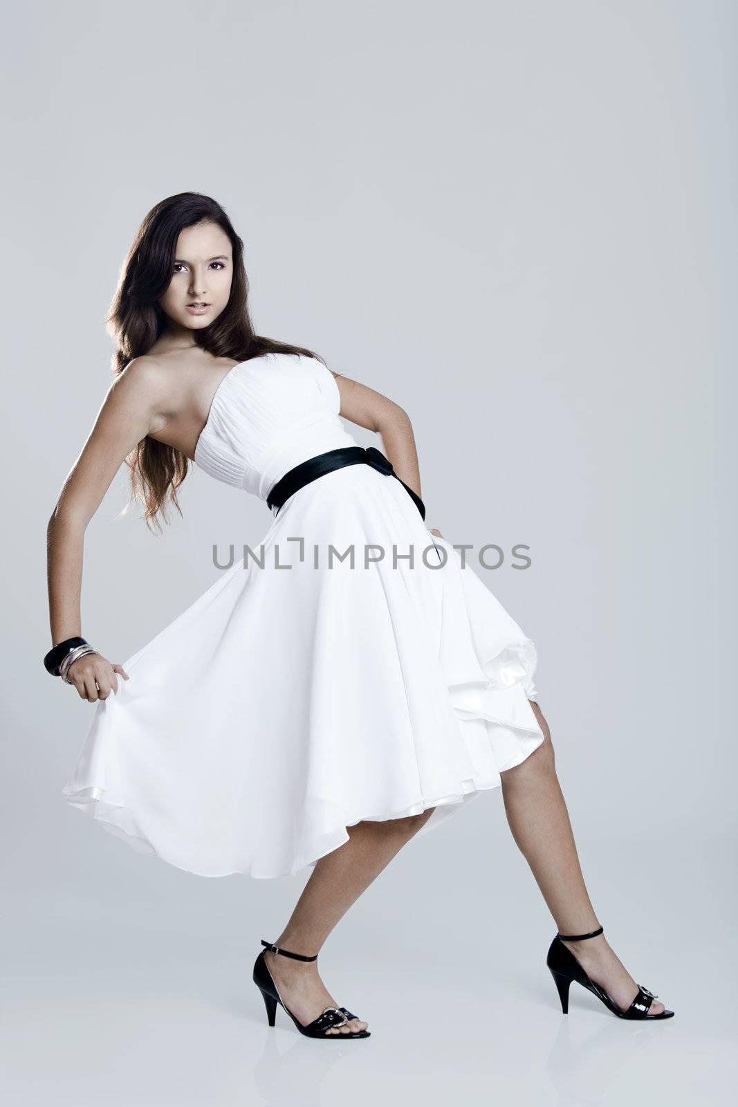 Beautiful and sexy woman wearing a wonderful white dress