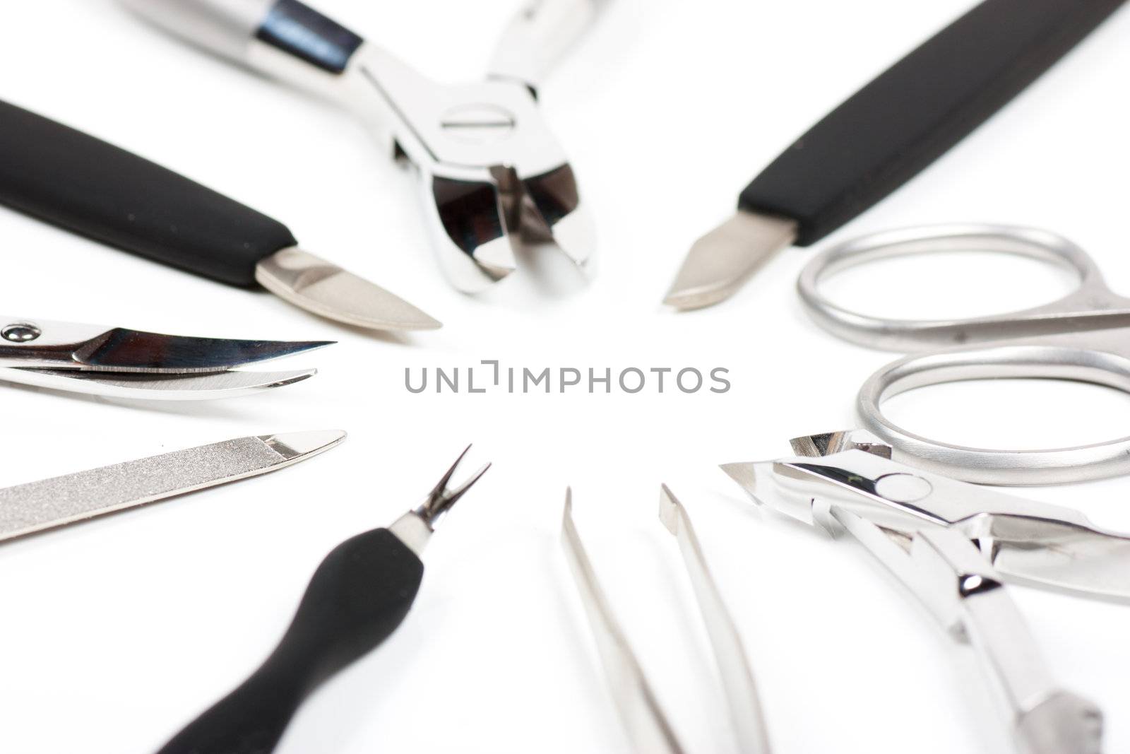 A set of metallic manicure tools.