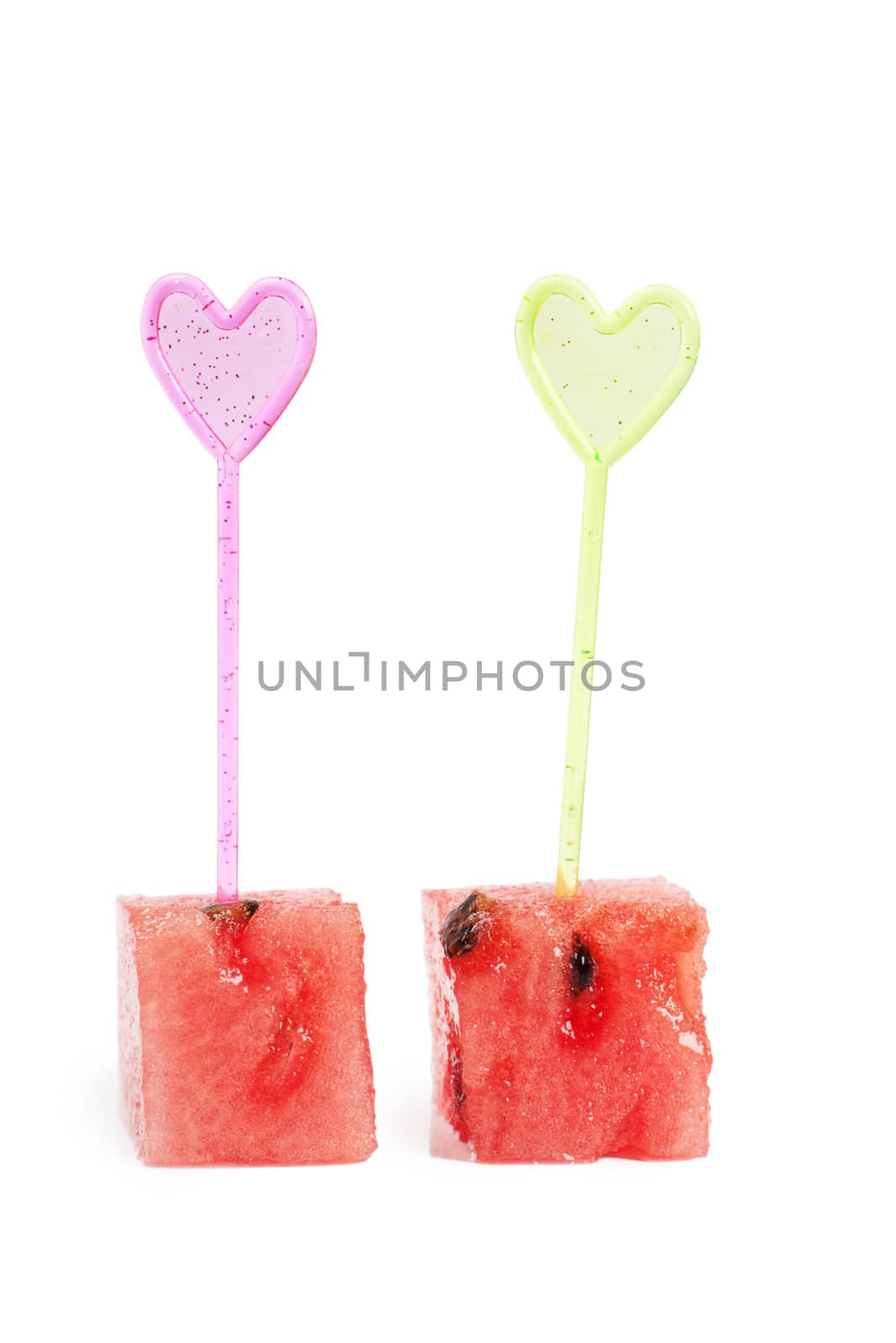 Macro view of fresh watermelon slices with heart-shaped sticks