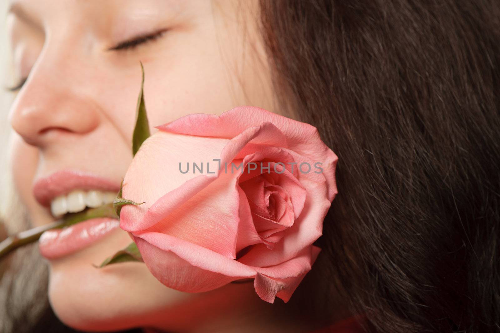 The woman with a rose closeup