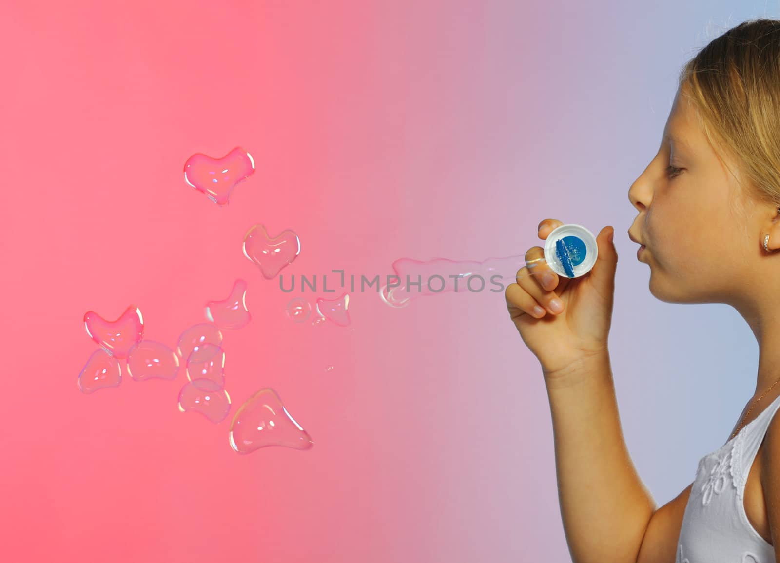 The pretty girl with bubbles heart. A  blue background