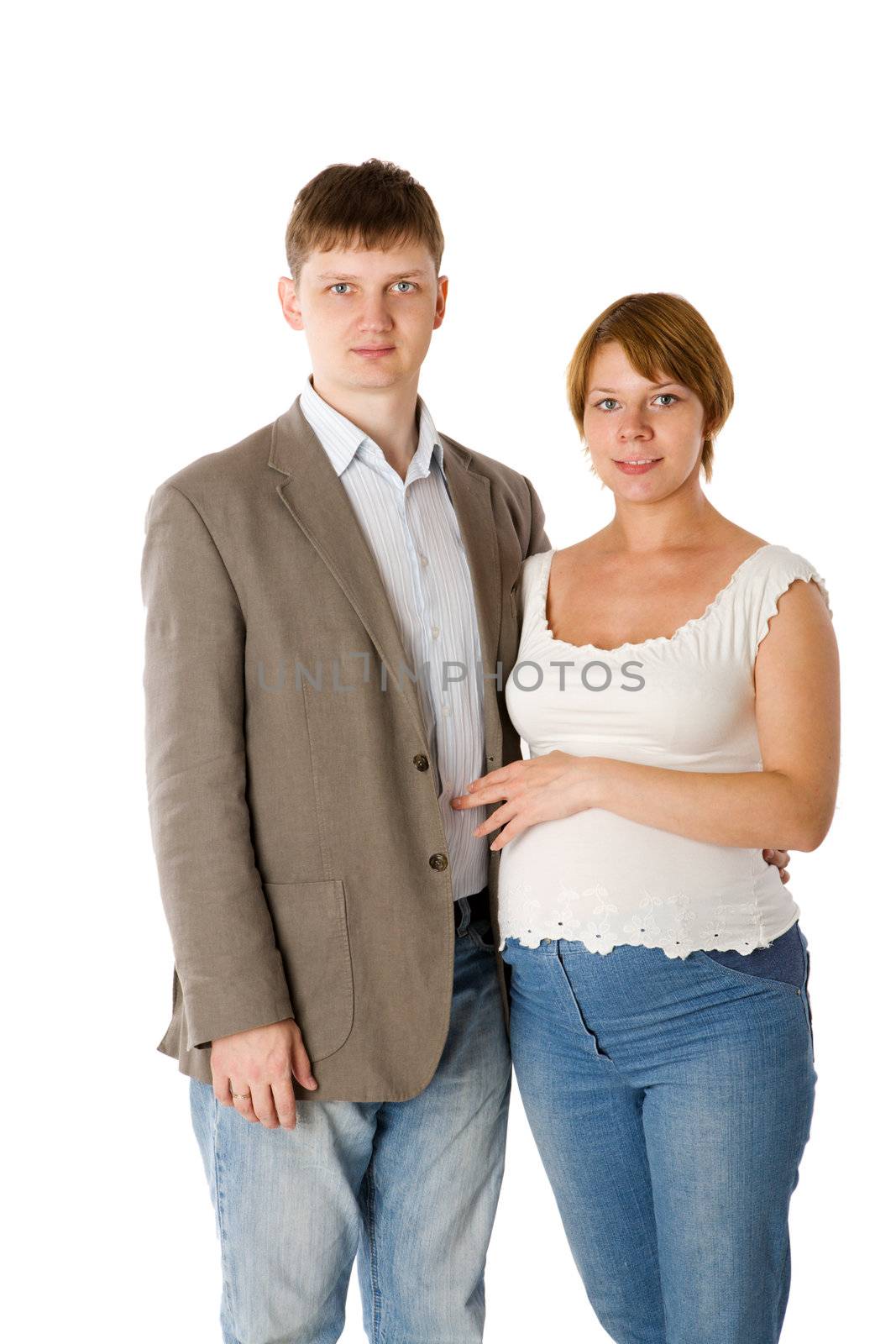 Pregnant couple posing together isolated on white