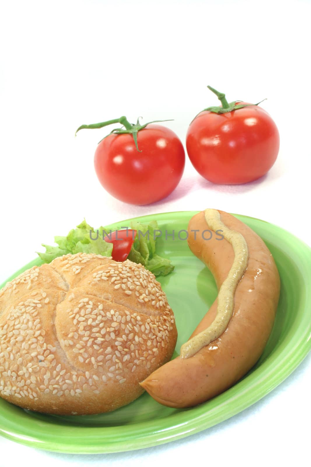 Bockwurst with bread and salad on a white background