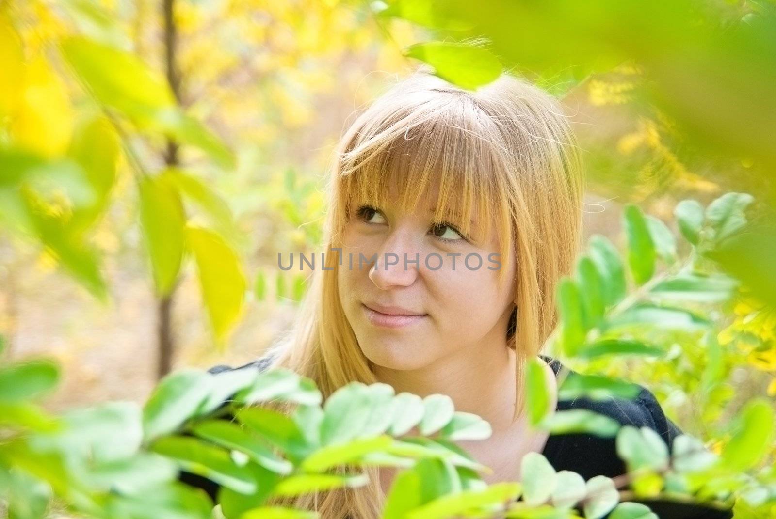 Teenage girl in fall foliage