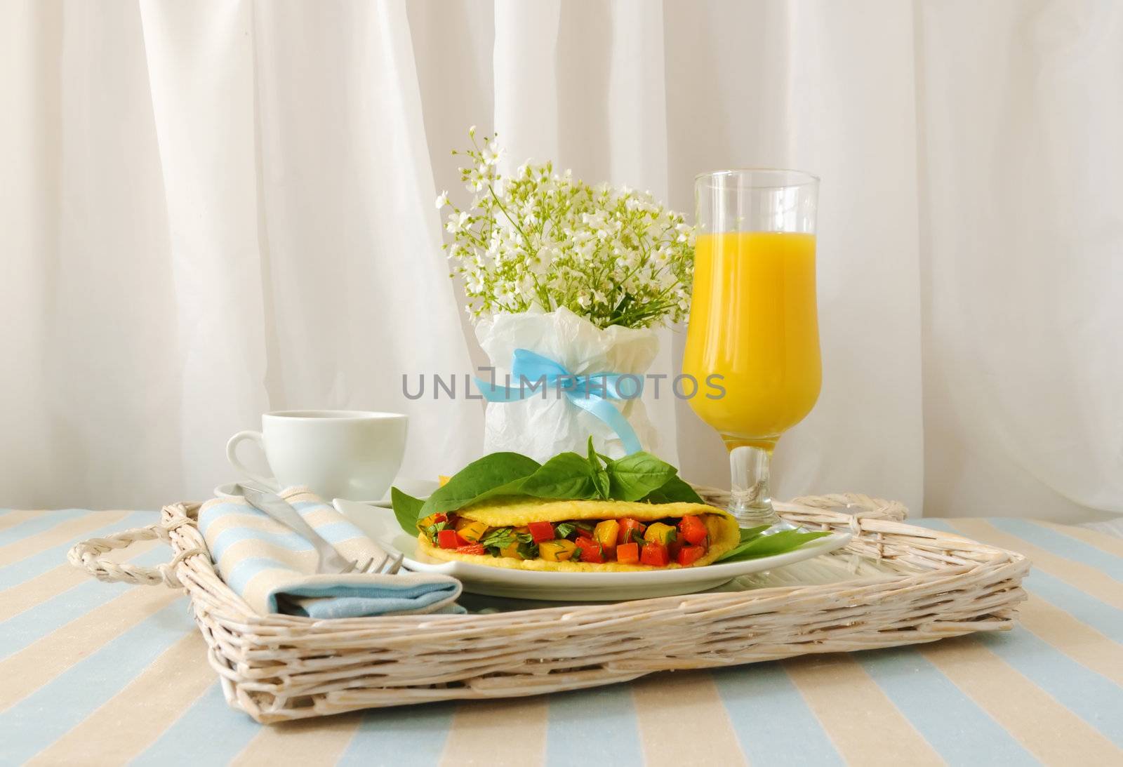 Omelette stuffed with vegetables with basil isolated
