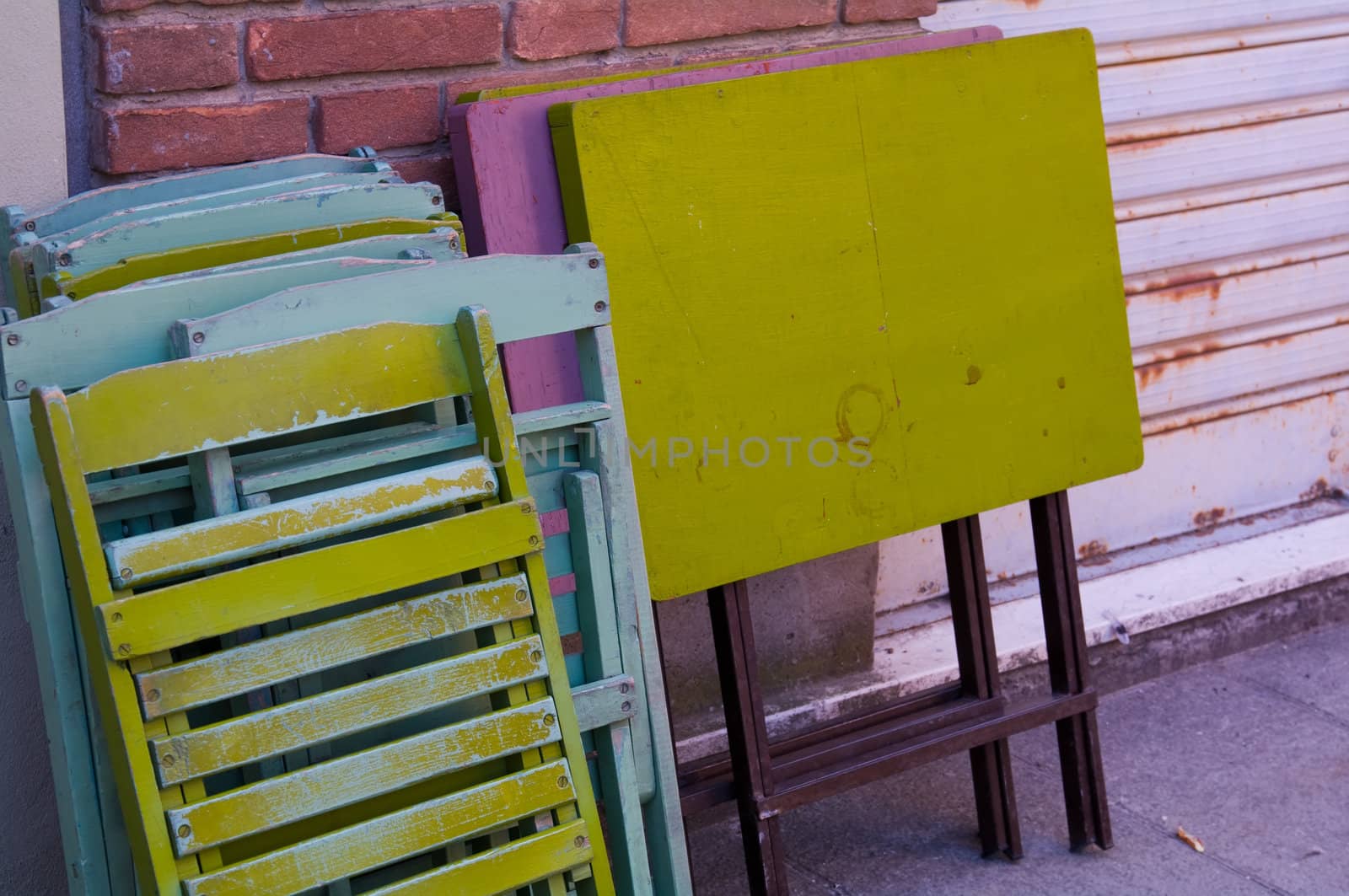 Tables and stairs with different colors on a wall