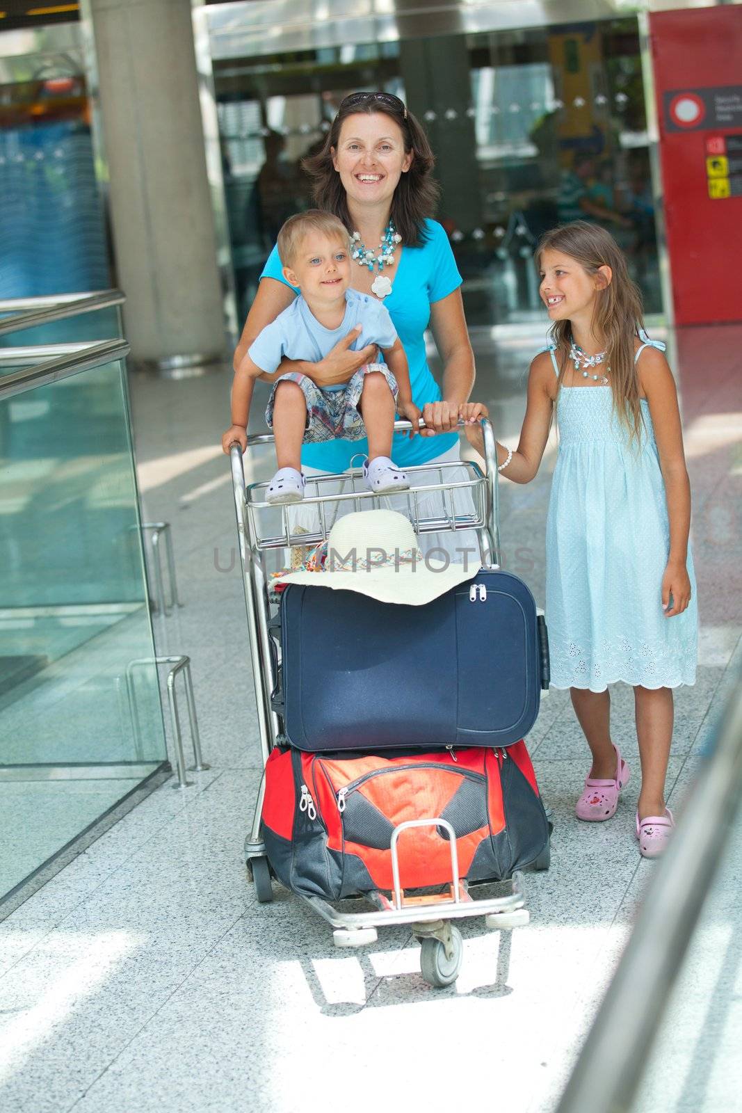 Young mother and child in the airport