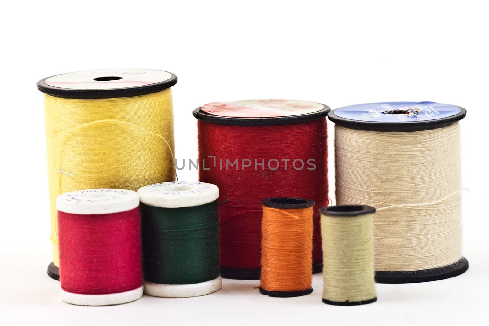mixed colors and sizes of thread used to sew