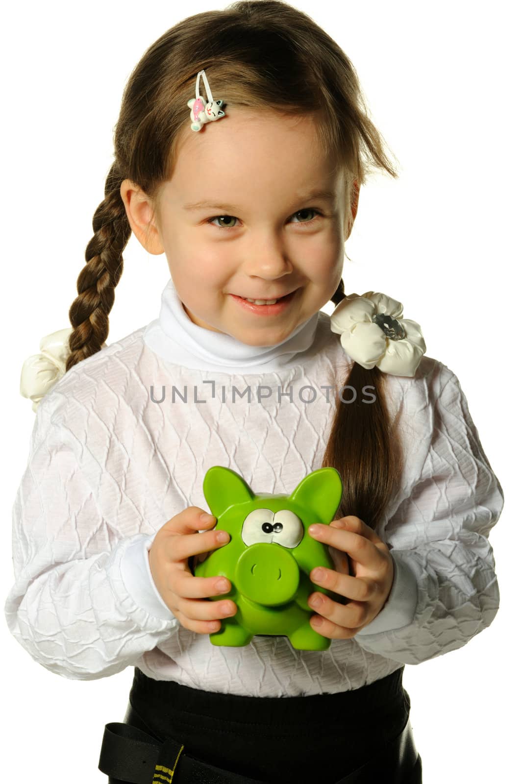 The little girl with a money box - a pig. It is isolated on a white background