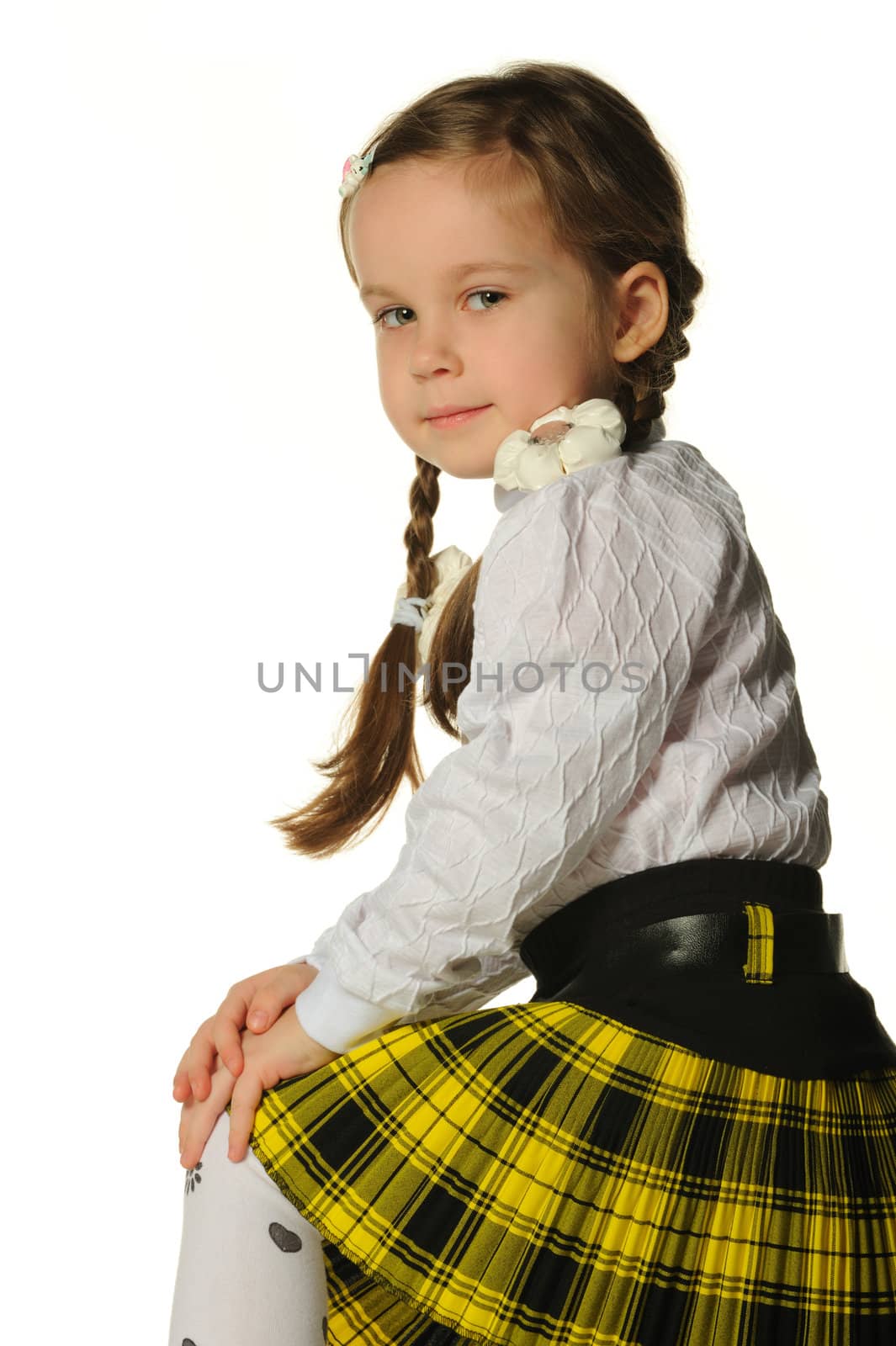 Portrait of the pretty little girl. It is isolated on a white background