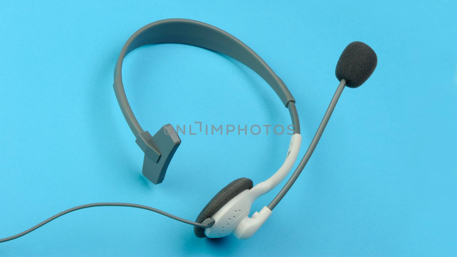 Headphones with a microphone of a support service. On blue background