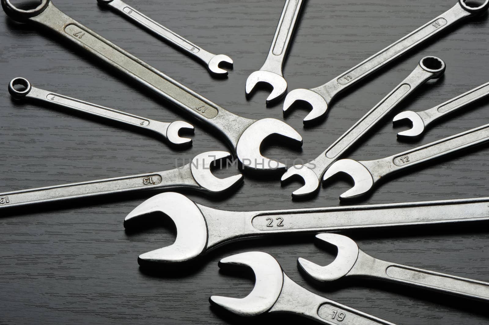 Wrenches. Wrenches on a black wooden surface