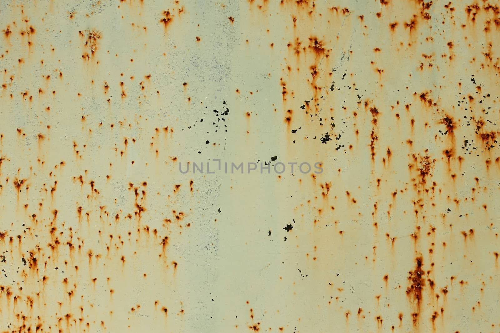 Old painted metal surface with shelled paint and rusty smudges