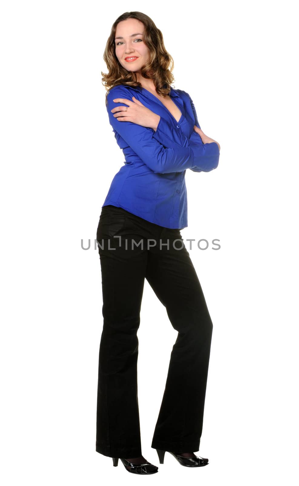 The attractive girl in trousers and dark blue shirt. It is isolated on a white background