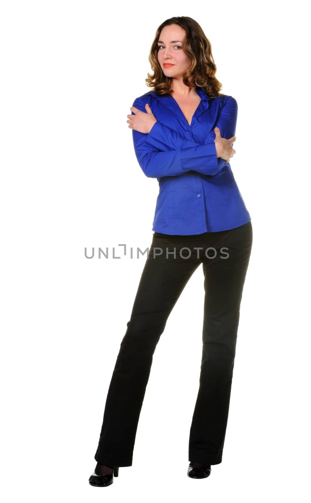 The attractive girl in trousers and dark blue shirt. It is isolated on a white background