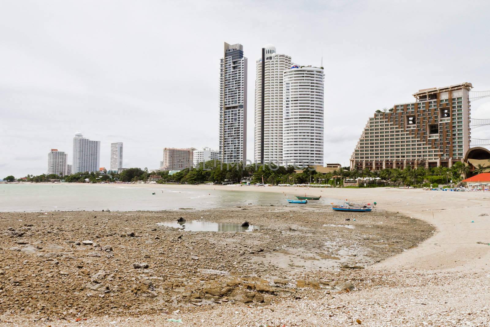 Beach, rocks, and hotels. The sea east of Thailand.