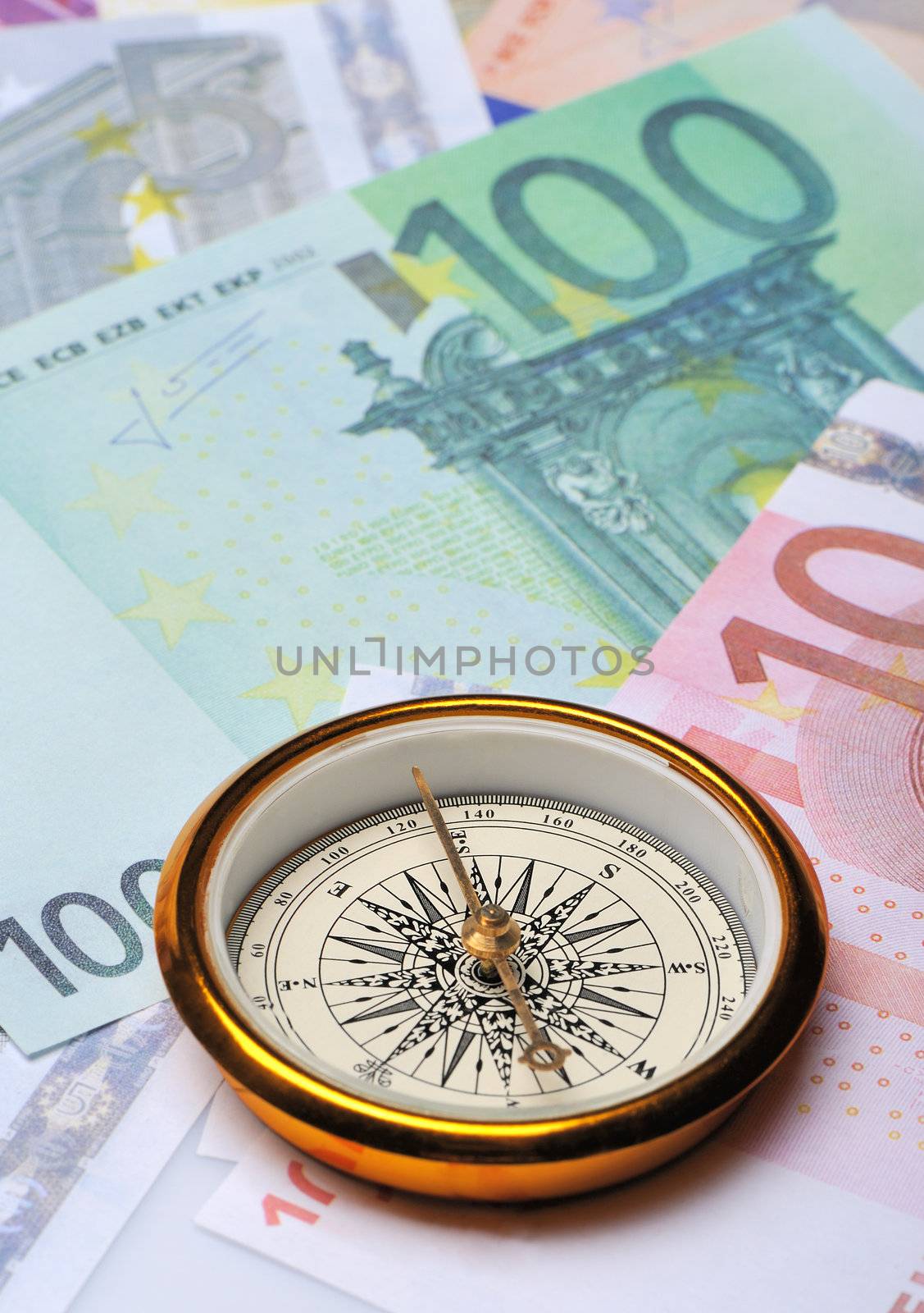 Euro and compass. Concept about a direction in business