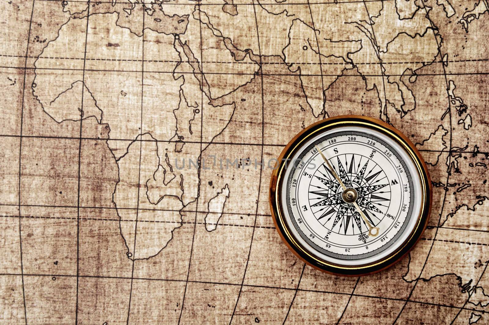 Compass on old map. Brown tone color