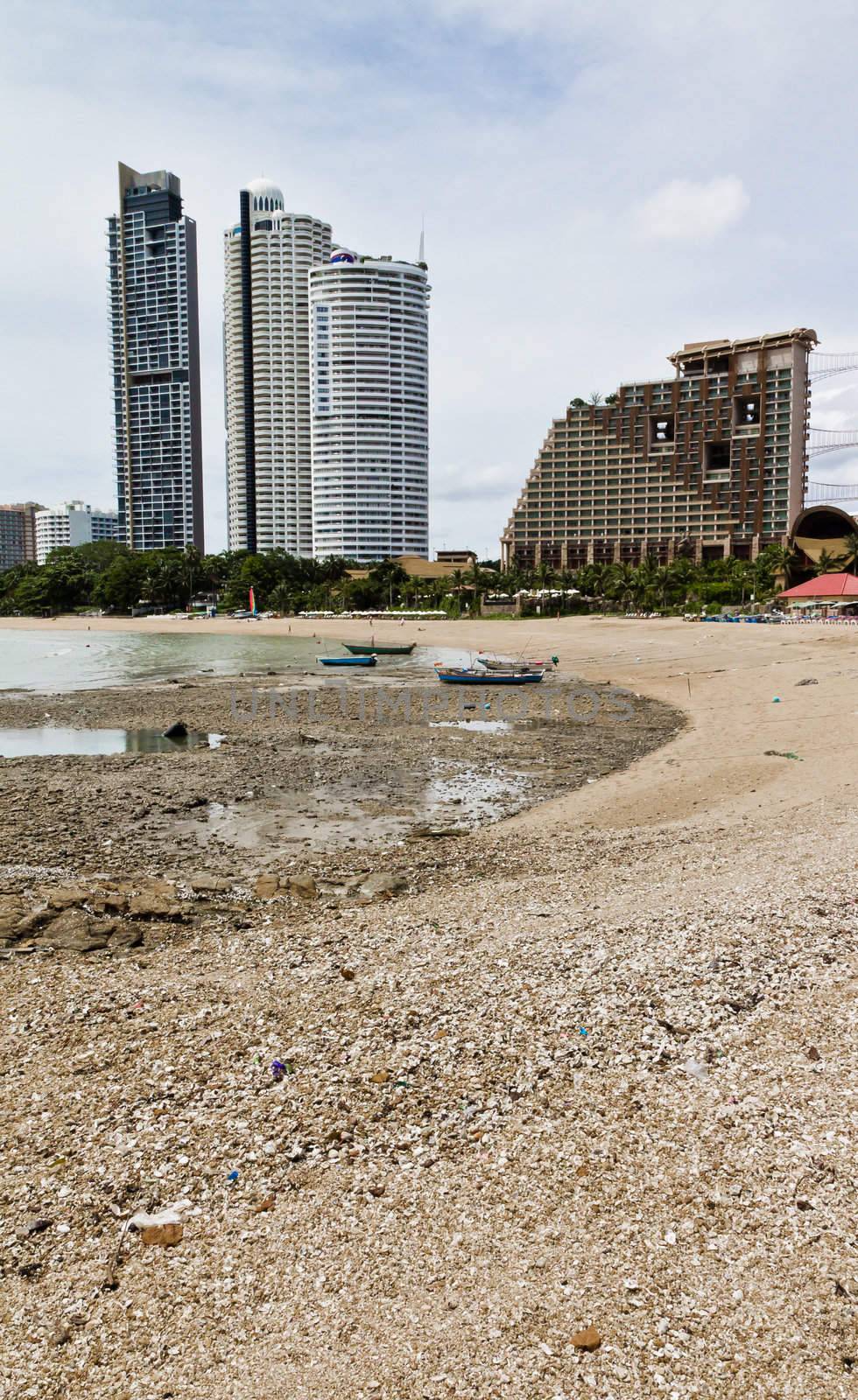 Beach, rocks, and hotels. The sea east of Thailand.