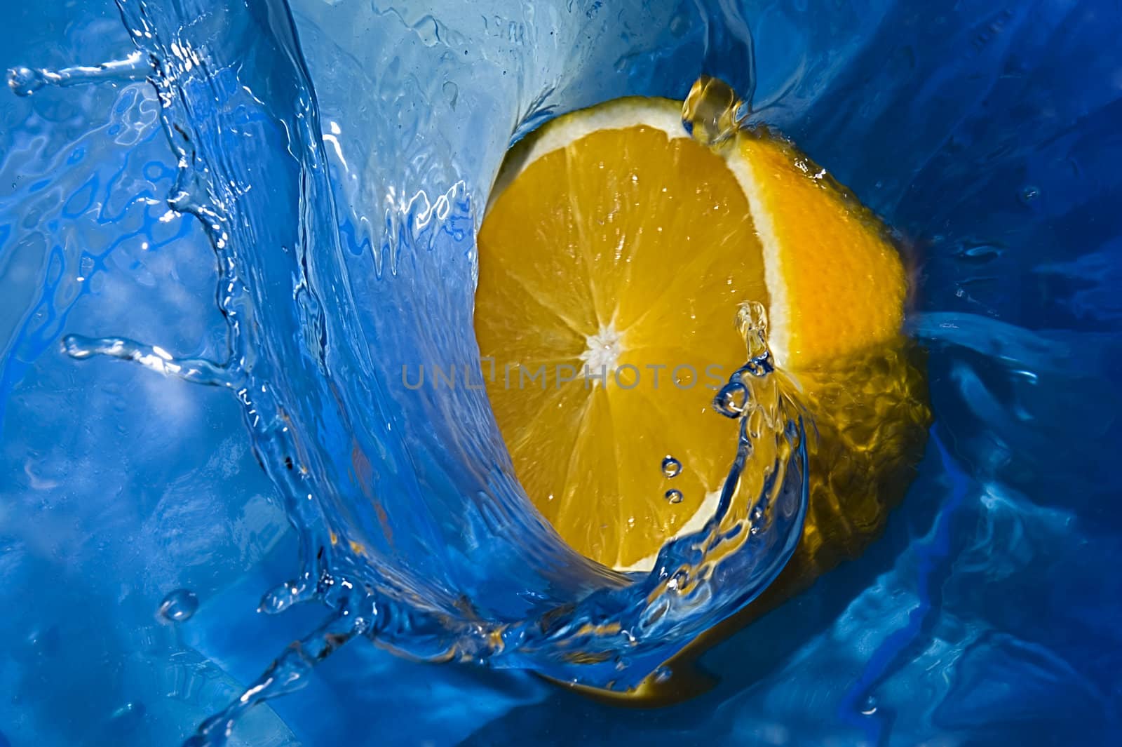 Segment of the orange in flow of freshness by Aleksandr