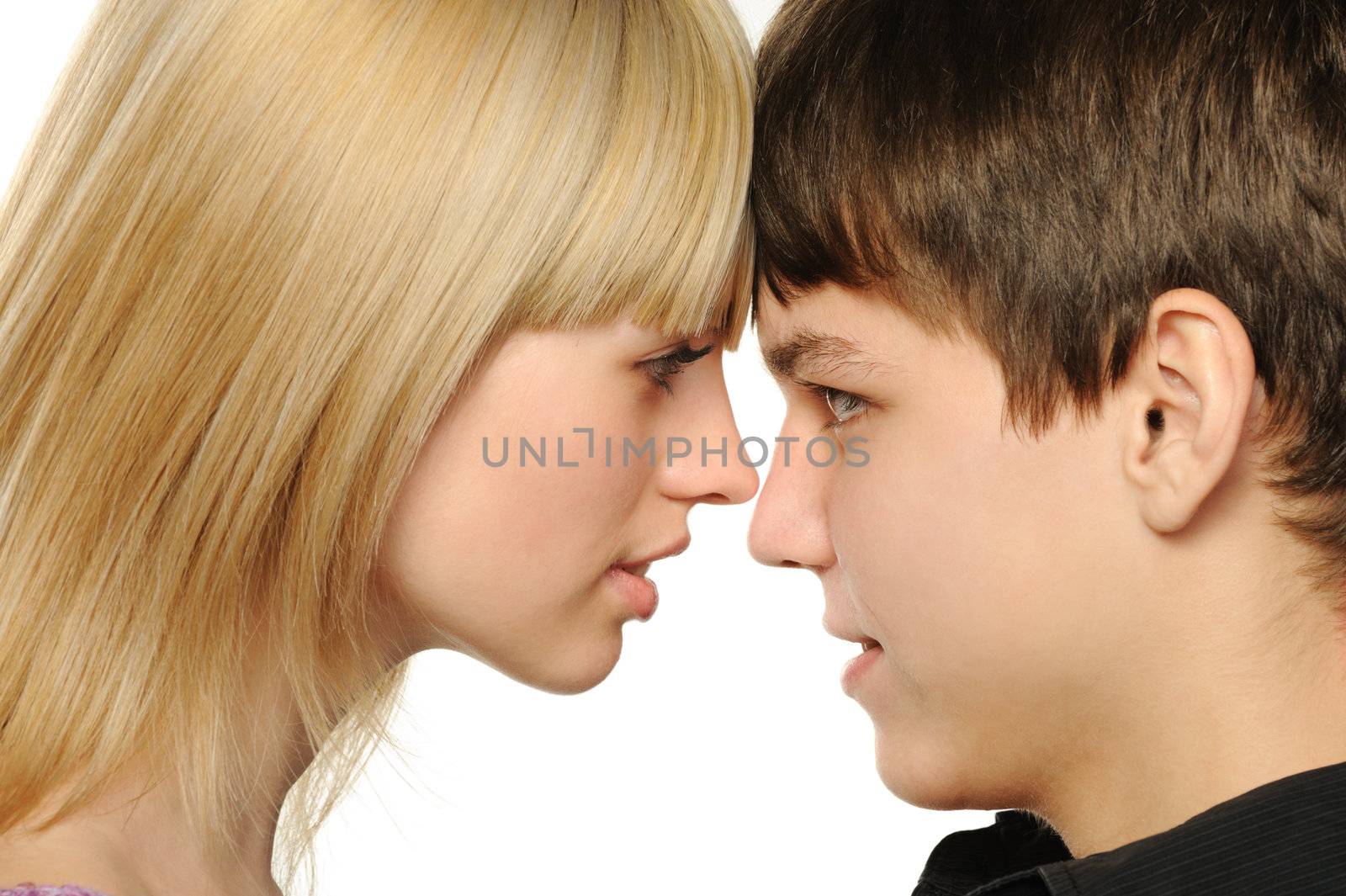 Young enamoured pair. It is isolated on a white background