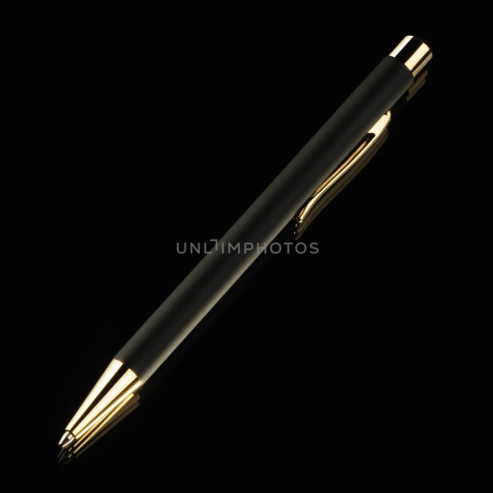 Black pen on a black background. Yellow metal