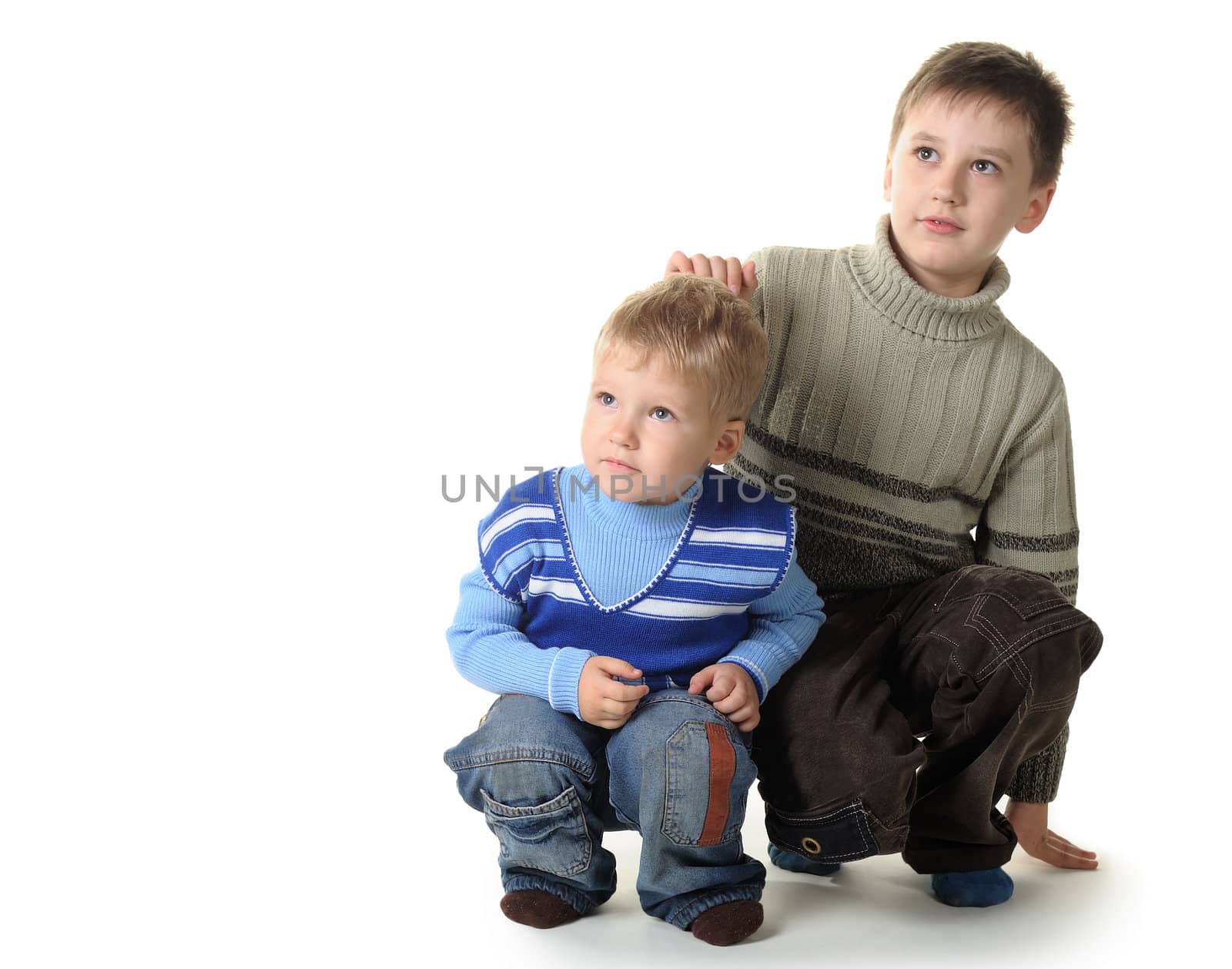 Two brothers. Age of 3 and 7 years. It is isolated on a white background