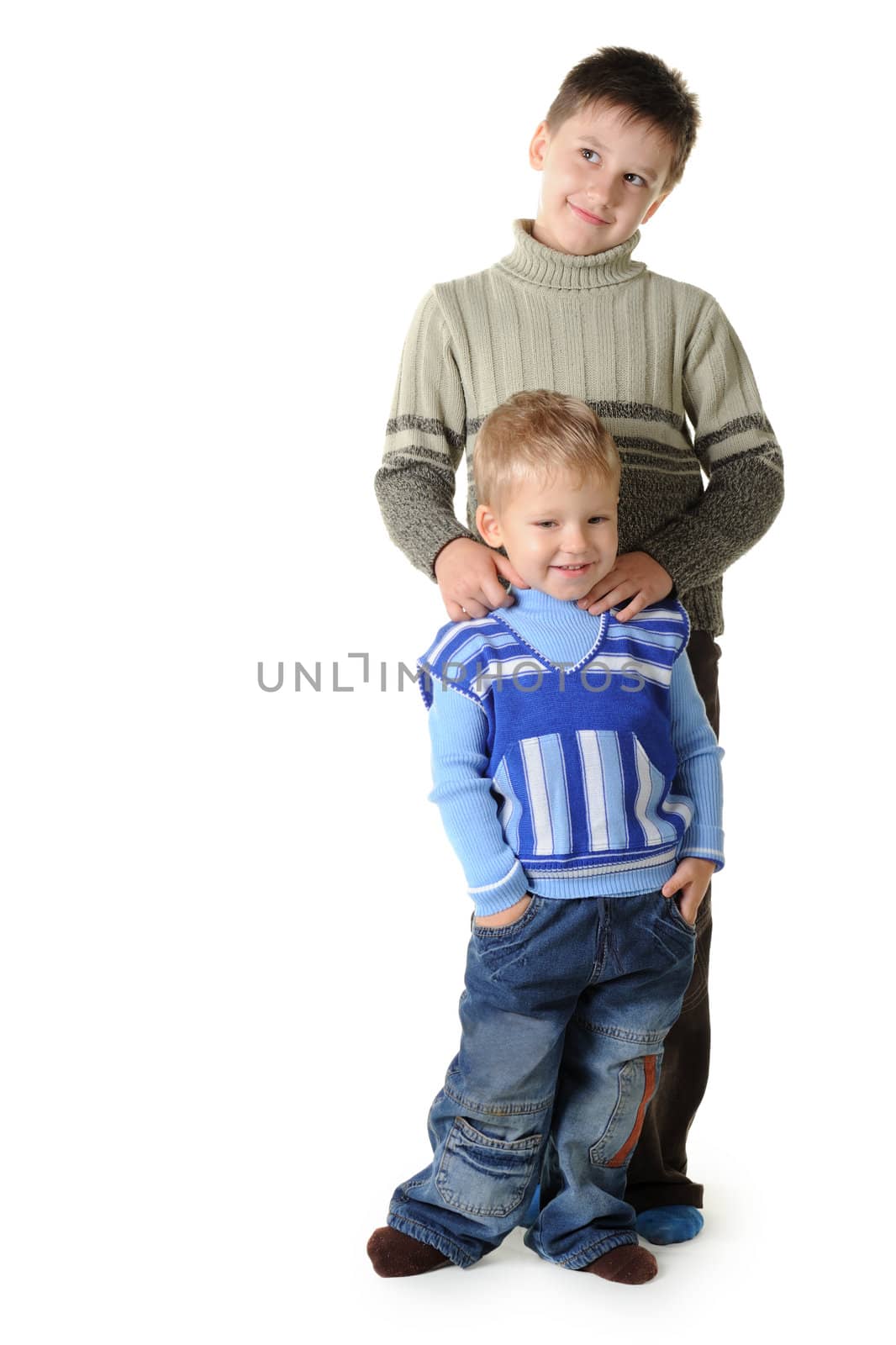 Two brothers. Age of 3 and 7 years. It is isolated on a white background